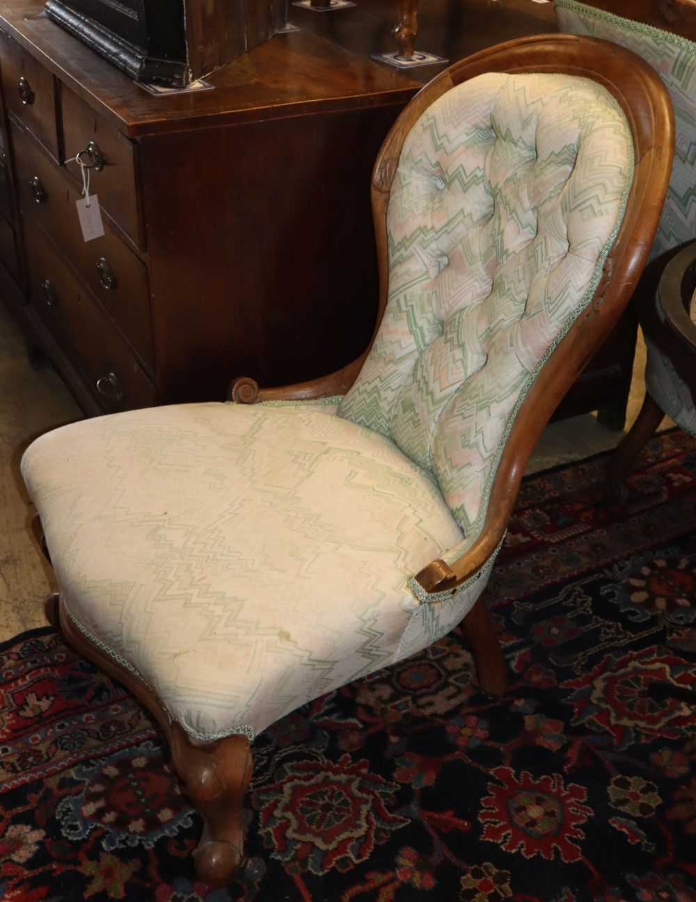 A Victoian buttonback armchair and matching nursing chair